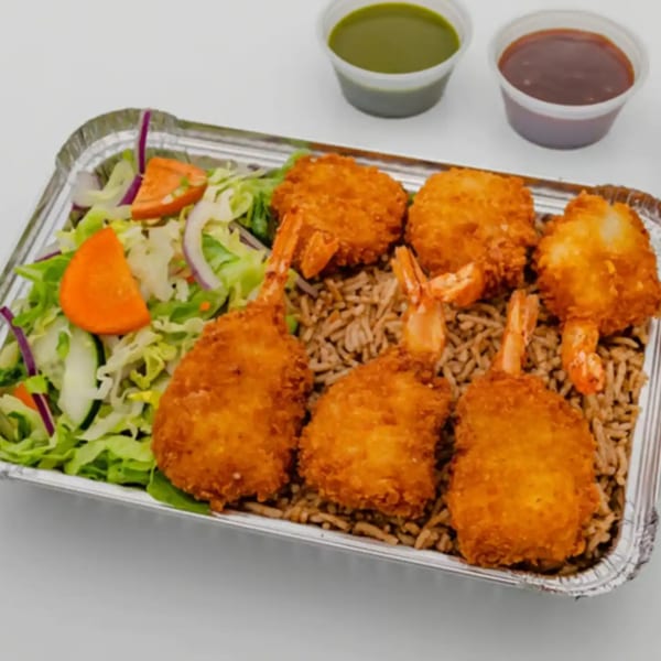 Zamzam Halal's fried shrimp and rice platter with a side salad and two dipping sauces.